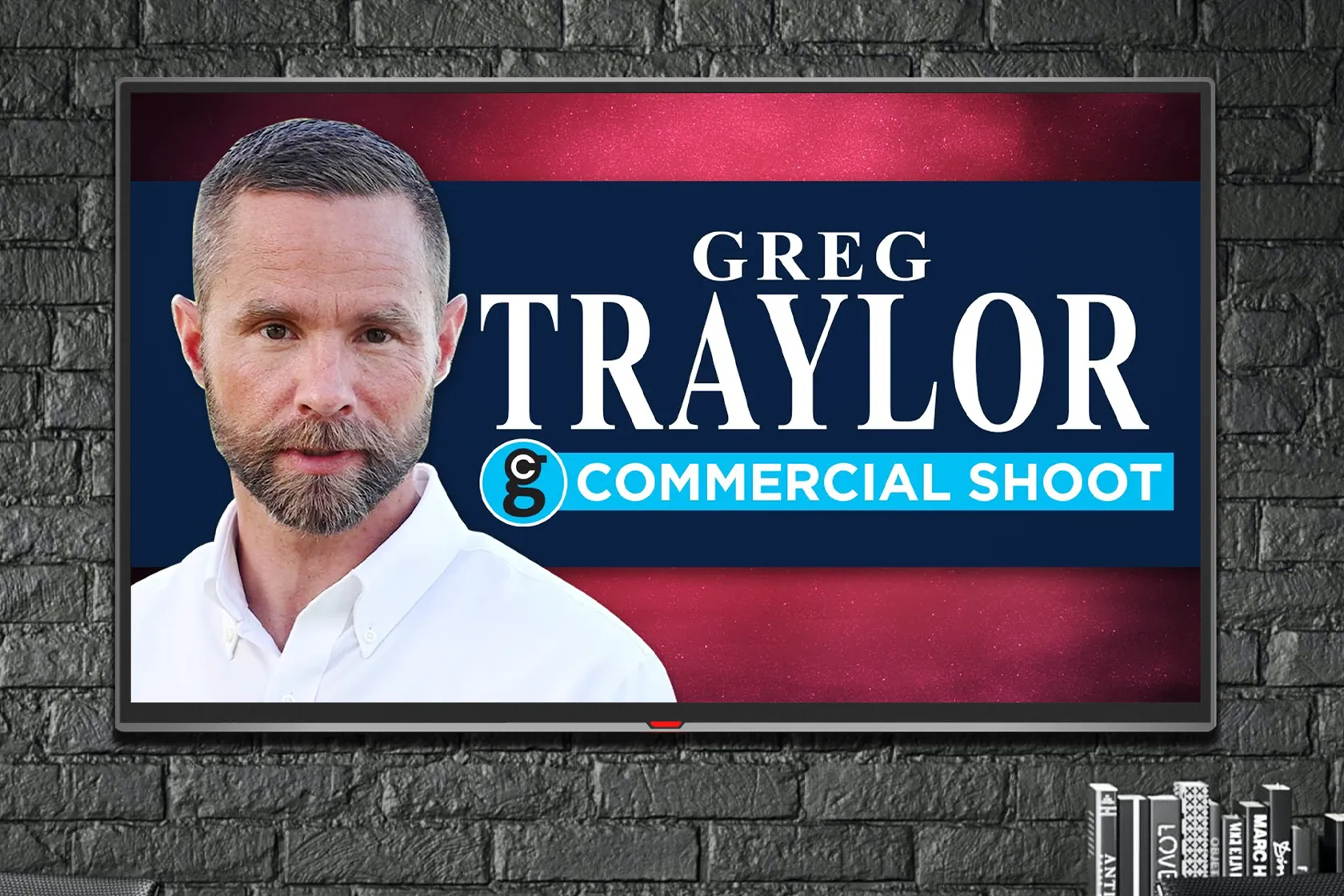 Greg Traylor TV Commercial Video on TV against a gray brick background
